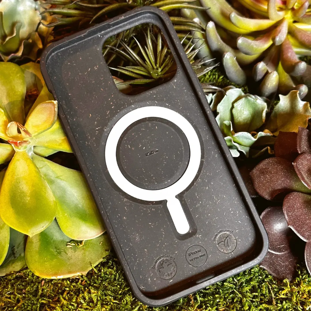 Black Pela phone case with a white MagSafe ring fitted