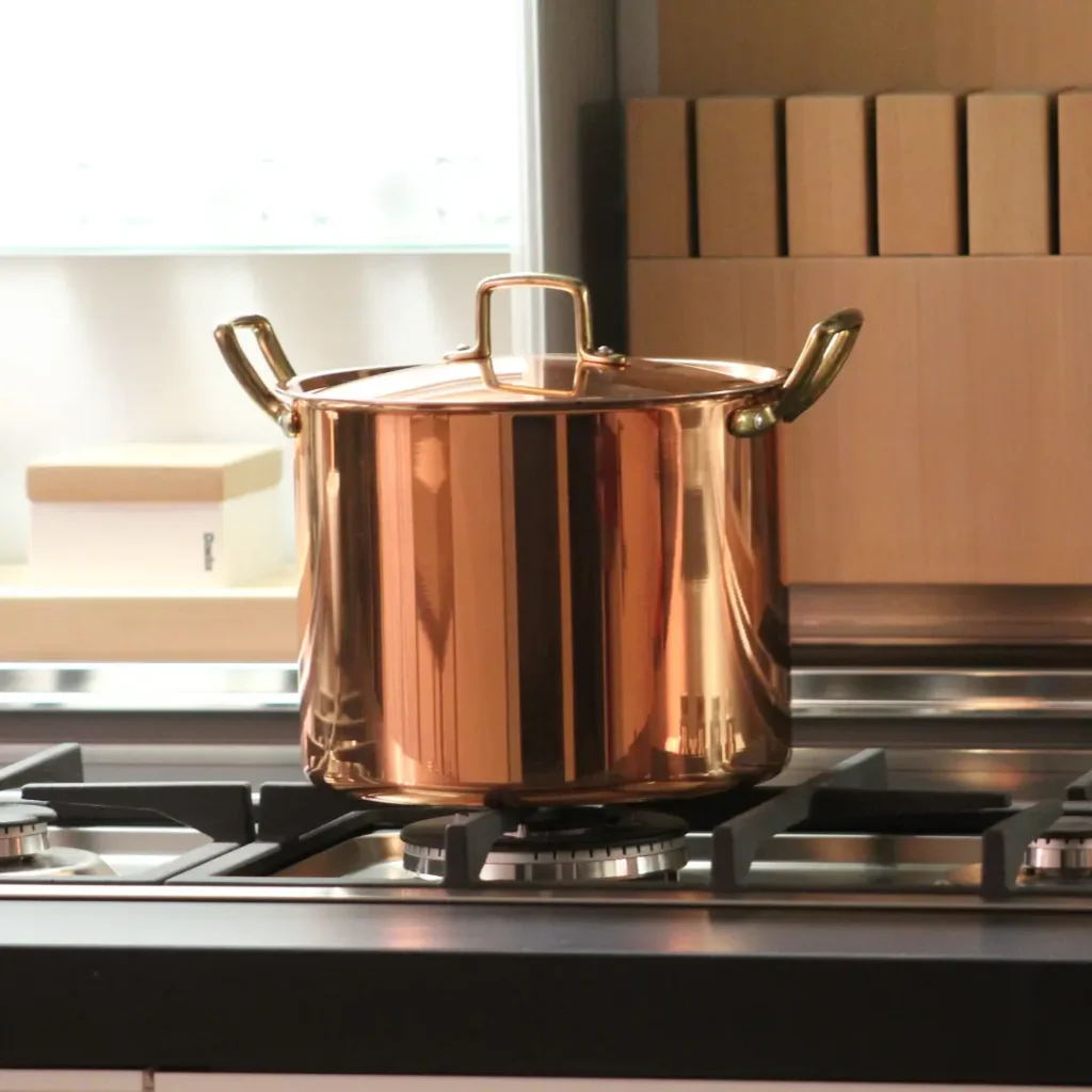 Health Concerns with Using Copper Cookware Copper pot on a stove
