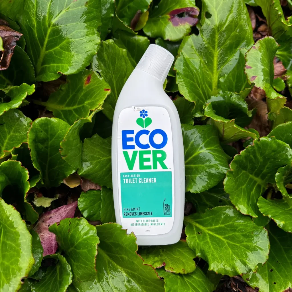 Ecover Fast-Action Toilet Cleaner in a Natural Setting A bottle of Ecover Fast-Action Toilet Cleaner placed on fresh green leaves outdoors, highlighting the product’s eco-friendly focus.