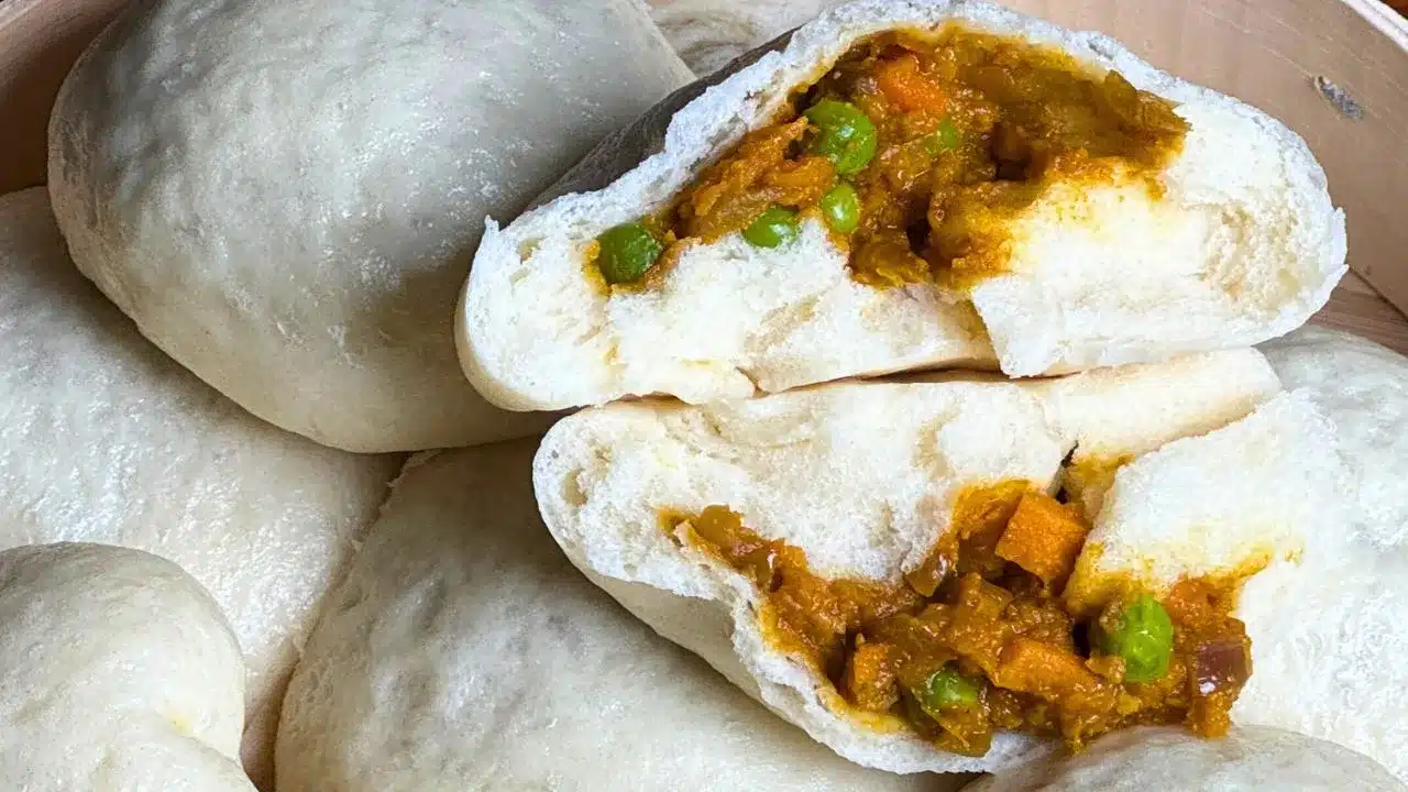 Sweet potato and peas curry steamed bun cut open