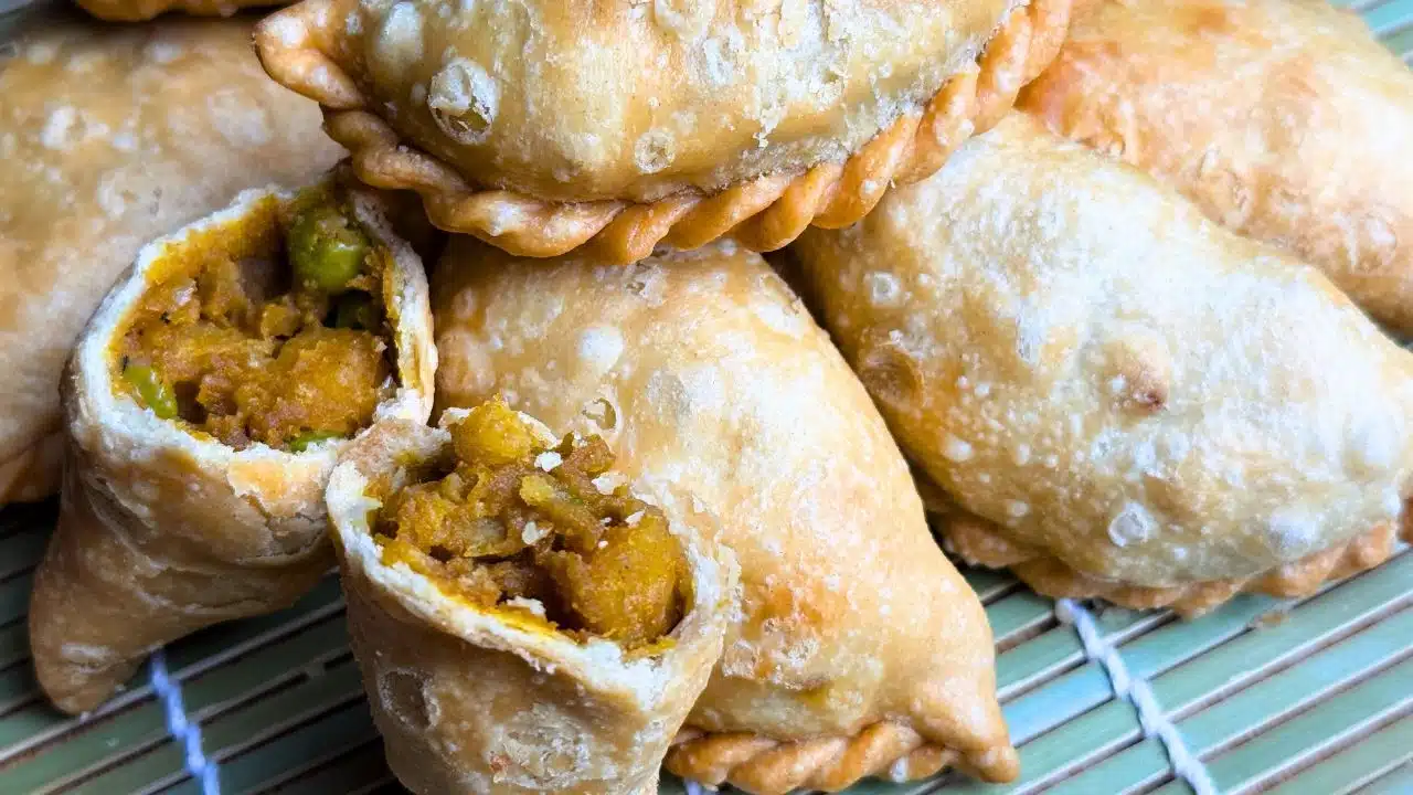 Vegan potato curry puffs with crispy golden pastry and spiced potato filling